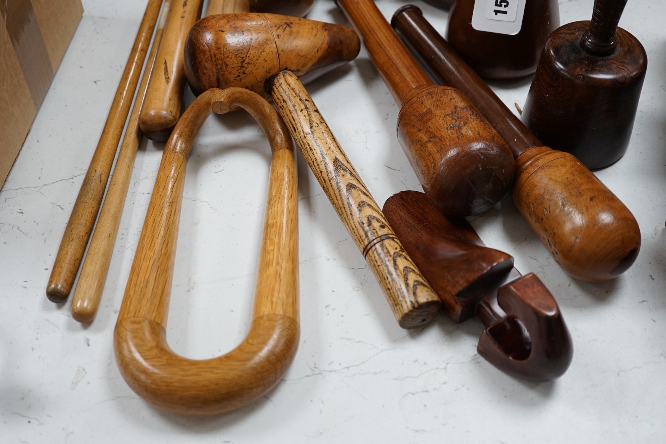 A mixed collection of treen leather and lead working tools etc. tallest 70cm